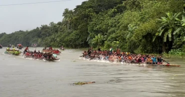 কুমার নদে ১২৫ বছরের ঐতিহ্যবাহী নৌকা বাইচে মানুষের ঢল