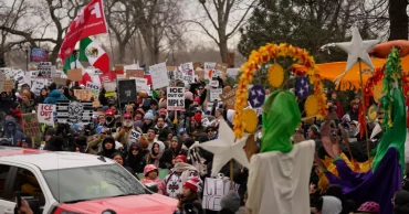 Thousands protest in Minneapolis over fatal ICE shooting, leaders urge peace