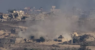 Strikes across Gaza kill at least 31 as scholars accuse Israel of genocide