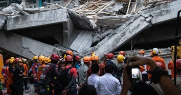 Indonesian rescuers racing against time to save students trapped in collapsed school