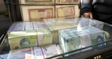 Iran's rial hits a record low, battered by regional tensions and an energy crisis