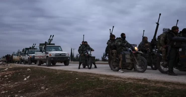 Syrian troops move into northern towns after Kurdish fighters pull back