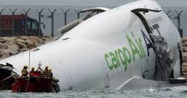 Cargo plane overshoots runway in Hong Kong, crashing Into sea and killing two airport workers