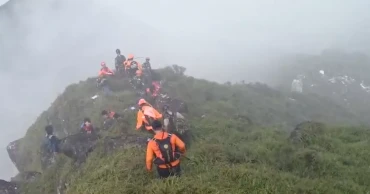 Indonesian rescuers find body near wreckage of a plane that crashed with 11 aboard