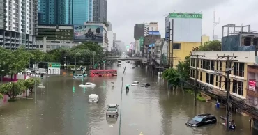 Heavy rain and flooding in Bangkok disrupts traffic and prompts evacuations