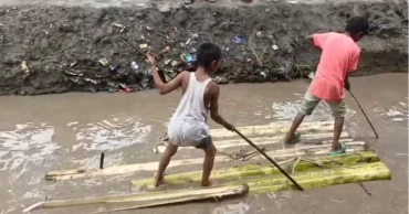 Dug-up road turns into knee-deep canal; Kaliganj villagers have to use rafts