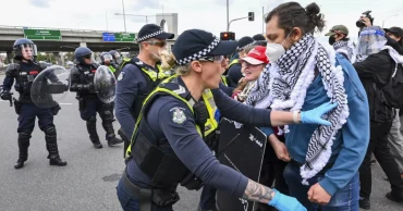 Anti-war protesters in Australia clash with police outside a weapons convention