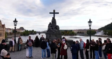 Depeche Mode fans flock to Prague bridge to recreate iconic band photo