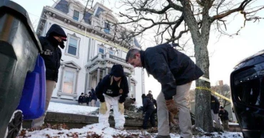 Search continues for Brown University gunman as security questions mount