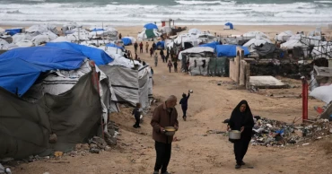 Winter rain floods Gaza camps; Netanyahu heads to US talks