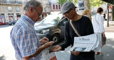 France's last newspaper hawker to receive national honour  from President Macron 