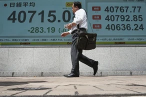 Asian shares mostly rise as Wall Street stocks continue to decline