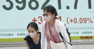 Asian shares mixed as Trump’s tariff deadline looms, while US stocks set records