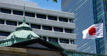 Bank of Japan raises its key interest rate, aiming to curb yen's slide against the dollar