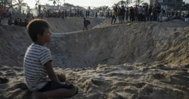 An Israeli strike on a Palestinian tent camp kills at least 19