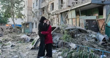 Russian attack on Ukraine kills at least 18 and traps others in damaged buildings