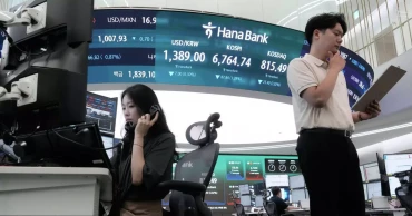Asian shares mostly fall as bond market pressure intensifies