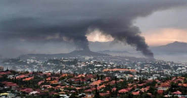 New Caledonia reopening its international airport and shortening curfew as unrest continues to ebb