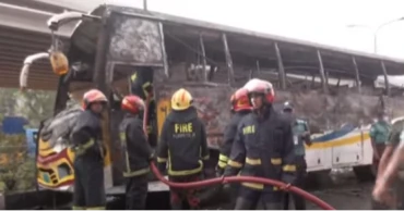 Bus catches fire in front of naval headquarters in city's Banani