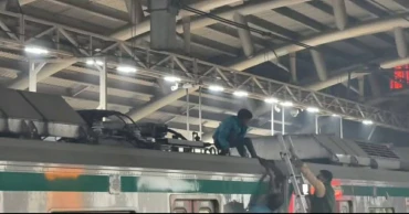 Metro service suspended after youth climbs on train roof
