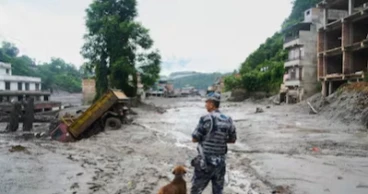 Rescuers save mud-covered survivors as Nepal-China flood death toll nears 600