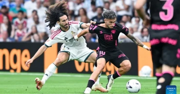Real Madrid thrash Malaga 4-0 to maintain perfect start