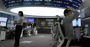 Asian shares mostly lower, trading in a narrow range with US markets closed for Memorial Day