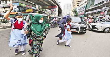 Schools must assign staff to help students cross roads safely: Hasina