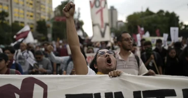 Generations of students remember 1968 massacre in march through Mexico City