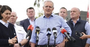 Australia's leader apologizes for vacation amid wildfires