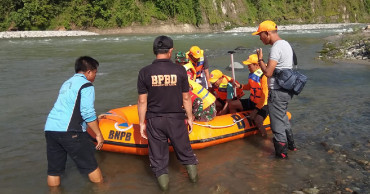 Crowded footbridge breaks over Indonesian river, killing 9