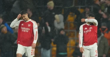 Arsenal blows two-goal lead at Wolves, boosts Man City’s title hopes