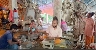 Narayanganj artisans passing busy time making idols for Durga Puja