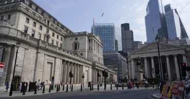 Bank of England keeps its main interest rate on hold at 5% in wake of big US Fed rate cut