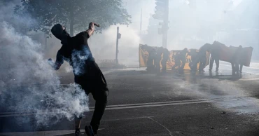 Protesters clash with police in Geneva ahead of G7 summit in France