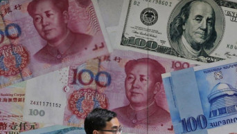 China's yuan falls further to US dollar amid trade war fears