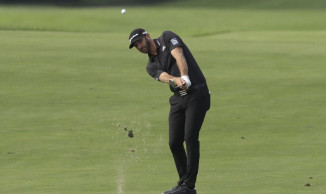 Johnson takes 1-shot lead over Spieth at Liberty National