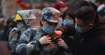 Virus death toll in China rises as US prepares evacuation