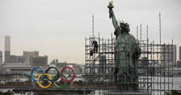 Olympic rings arrive in host city on barge into Tokyo Bay