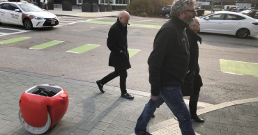 Grocery-carrying robots are coming. Do we need them?