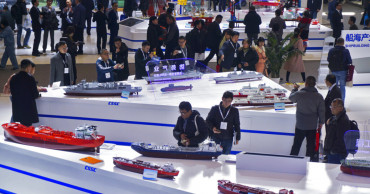 China promises tariff cuts, more competition in markets