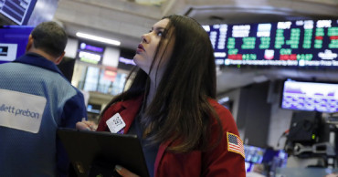 Asian stocks mixed after Wall Street rises to record