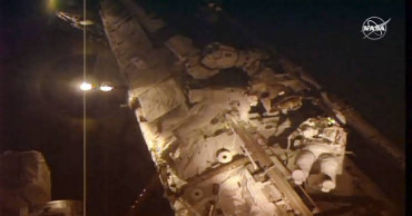 Spacewalking astronauts close to fixing cosmic ray detector