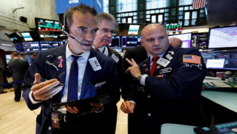 US stocks claw back lost ground as China stabilizes currency