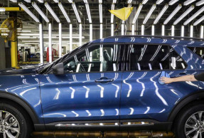 Ford 2Q profit falls, says more restructuring charges coming