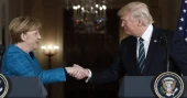 German ex-leader Merkel says she felt sorrow at Trump's comeback and recalls awkward non-handshake