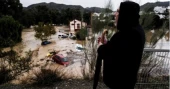 Flash floods in Spain sweep away cars, disrupt trains and leave several missing