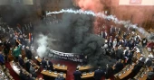 Serbian lawmakers injured as smoke bombs, flares thrown in parliament