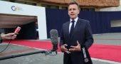 Macron calls for coordinated US-Iran move to reopen Hormuz