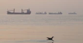 Iran reports four oil tankers hit mines, catch fire in the Strait of Hormuz amid rising Middle East tensions